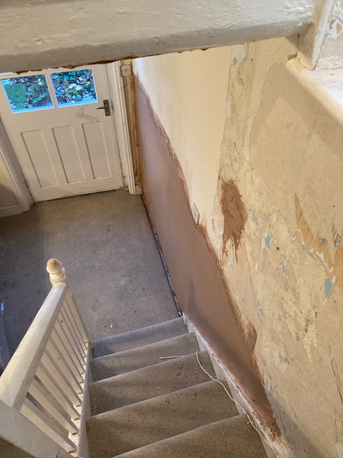 Wall stripped back for damp work